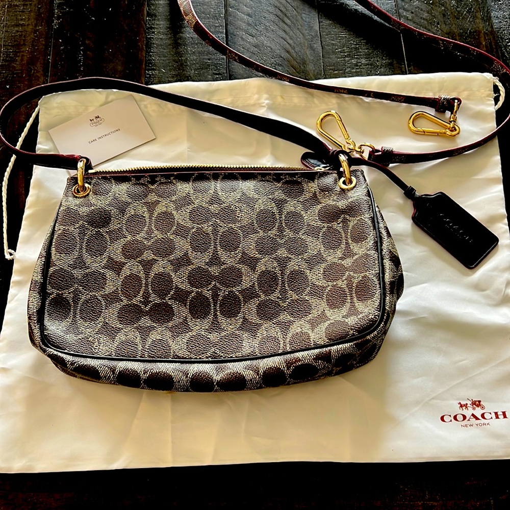 NWOT Coach purse w shoulder strap, protective sleeve & care instructions